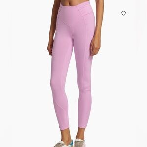 FP Movement's Spin Me leggings showcase stretchy knit and mid-rise fit.